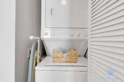 a laundry room with a washer and dryer at Beachfront Resort - Pool - Ocean View Balcony- Gym in Miami Beach