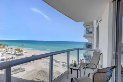 a balcony with chairs and a view of the beach at Beachfront Resort - Pool - Ocean View Balcony- Gym in Miami Beach