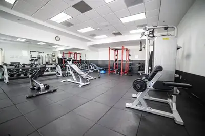 a gym with several treadmills and machines at Miami condo with city & ocean views! Sleep up to 6! in Miami