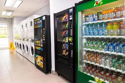 a store aisle with soda machines in a store at Miami condo with city & ocean views! Sleep up to 6! in Miami