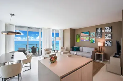 a living room with a kitchen and a living room at Zen Vacation Rentals Ocean Front at Lyfe Resort in Hollywood