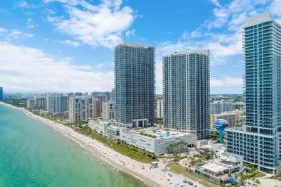 an aerial view of a beach with tall buildings at Million Dollar Ocean Front Penthouse by Zen Vacation Rentals in Hollywood