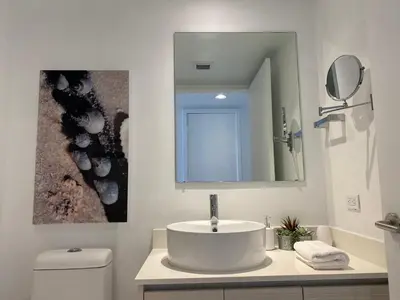 a bathroom with a sink and a mirror at Charming Room by the Beach Pure Relaxation 2004 B in Hallandale Beach