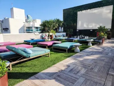 a group of chaise lounges on the grass on a rooftop at Modern Waterfront Retreat with Scenic Views in Hollywood