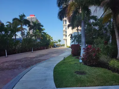 a street with palm trees and a building at Modern Waterfront Retreat with Scenic Views in Hollywood