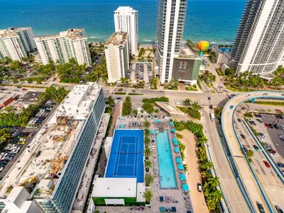 an aerial view of a city with a pool and the ocean at Modern Waterfront Retreat with Scenic Views in Hollywood