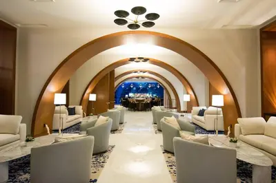a waiting room with white chairs and a table at Luxury 1 BR Suite at Fort Lauderdale in Fort Lauderdale
