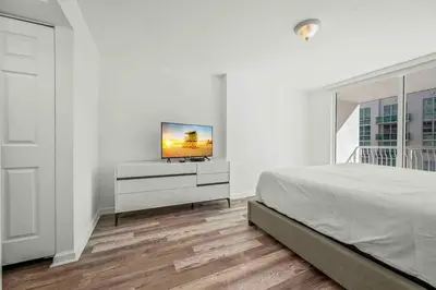 a bedroom with a bed and a tv on a dresser at Amazing 1 Bed 1 Bath • Brickell • City & Bay View in Miami