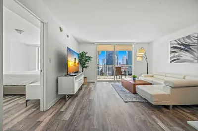 a living room with a couch and a bed at Amazing 1 Bed 1 Bath • Brickell • City & Bay View in Miami