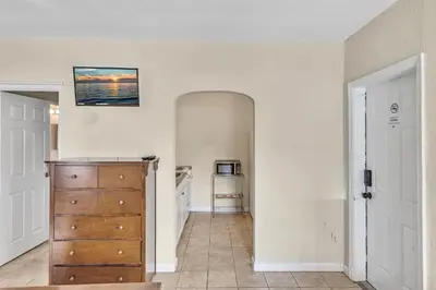 a kitchen with a large mirror and a wooden dresser at Charter House in Hollywood