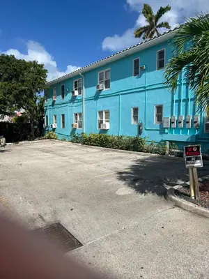 a blue building with a street sign in front of it at Charter House in Hollywood