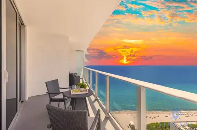 a balcony with a view of the ocean at Insane Ocean View Balcony - Beachfront Condo - Pool in Hollywood