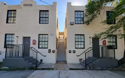 an old building with a staircase in front of it at Lovely Apartment Near Brickell 3 in Miami