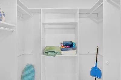 a closet with white walls and white shelves at Hollywood Vacation In Perfect Beach Location Ha01 in Hollywood