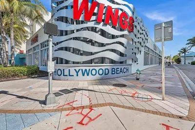 a building with a sign on the side of it at Hollywood Vacation In Perfect Beach Location Ha01 in Hollywood