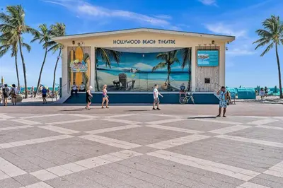 a group of people walking in front of a building at Large 2 Bed Studio Close to Beach & Hard Rock HA03 in Hollywood