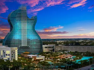 a guitar shaped building with a city in the background at Large 2 Bed Studio Close to Beach & Hard Rock HA03 in Hollywood
