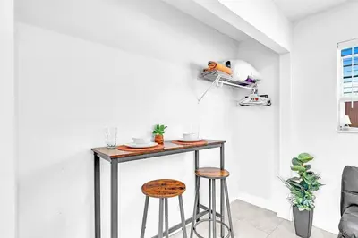 a room with a table and two stools at New 2 Bed Studio Close To Beach & Casino Ha04 in Hollywood