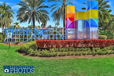 a colorful sculpture in a park with palm trees at Hollywood Large Studio Close to Beach & Casino LB3 in Hollywood