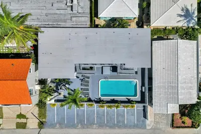 an overhead view of a building with a swimming pool at Waves On Desoto Rental Unit With Pool in Hollywood