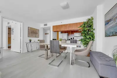 a living room with a table and a couch at Deluxe 1 Bedroom Apartment • Brickell • Ocean View in Miami