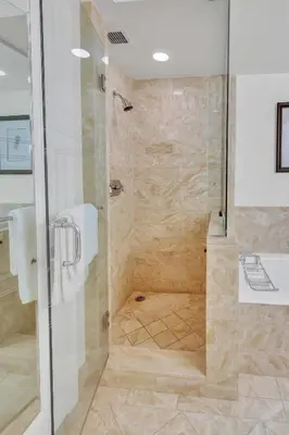 a shower with a glass door in a bathroom at Amazing private studio in Four Seasons Residences Brickell! in Miami