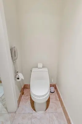 a white toilet in a bathroom with a phone at Amazing private studio in Four Seasons Residences Brickell! in Miami