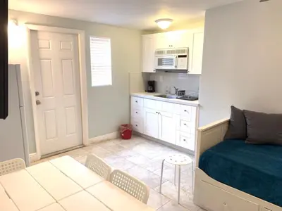 a small room with a bed and a kitchen at Private Hollywood APT Near Beach Airport & Casino in Hollywood