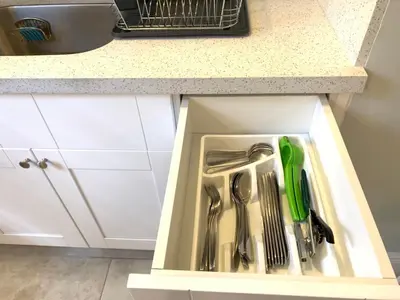 a kitchen sink with utensils in a drawer at Private Hollywood APT Near Beach Airport & Casino in Hollywood