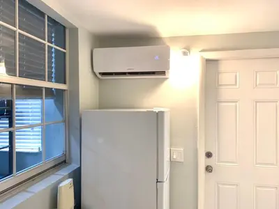 a white refrigerator in a kitchen with a window at Private Hollywood APT Near Beach Airport & Casino in Hollywood