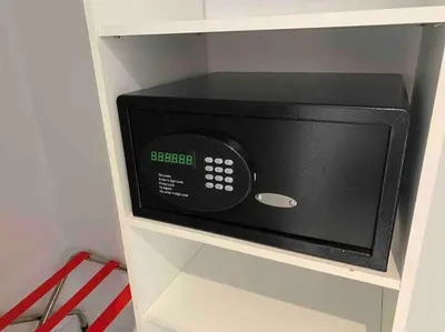 a microwave oven on a shelf in a kitchen at Beachfront Apartment in Miami Beach with Stunning Views 1A in Hallandale Beach