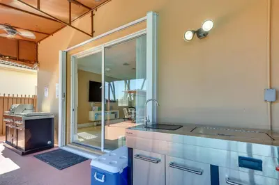 a kitchen with a sink and a mirror at Spacious Miami Retreat with Grill, Pool and Dock! in Miami