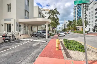 a fire hydrant on a city street with buildings at Sunny Miami Beach Condo Steps to Boardwalk! in Miami Beach