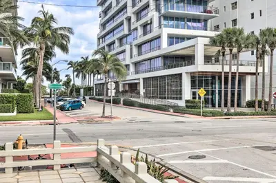 an empty street in front of a large building at Sunny Miami Beach Condo Steps to Boardwalk! in Miami Beach