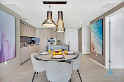 a kitchen and dining room with a table and chairs at Oceanfront Balcony - Endless Views - Amazing Pools in Hollywood