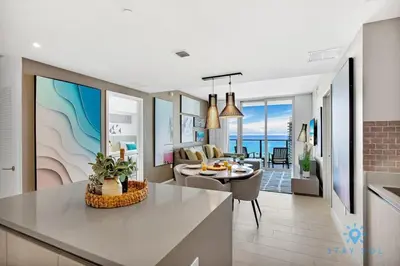 a kitchen and living room with a view of the ocean at Oceanfront Balcony - Endless Views - Amazing Pools in Hollywood