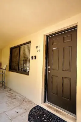 a black door in a room with a window at A 1bedroom Las Olas on the water in Fort Lauderdale