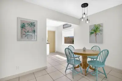a dining room with a table and chairs at LoKal Rental Tropical Florida destination in Fort Lauderdale