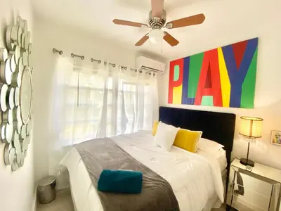 a bedroom with a bed and a ceiling fan at 3 Seasons at the Carrington 3 Two Bedroom 1 Bath Apts -6 Bedrooms 3 bathrooms and 3 bedroom 2 bathroom Villa in Miami