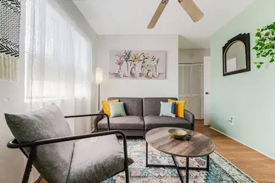 a living room with a couch and a table at 1BR Little Havana Apt stepts to Calle 8 in Miami