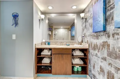 a bathroom with a sink and a mirror at Modern Ft Lauderdale Condo about 7 Mi to Airport! in Fort Lauderdale