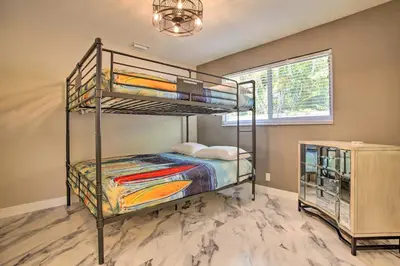 a bedroom with two bunk beds and a window at Wilton Manors Home with Pool about 4 Mi to Beach! in Fort Lauderdale