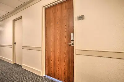 an open door in an office with a wooden door at Ocean-View Balcony Beachfront Hollywood Apt! in Hollywood
