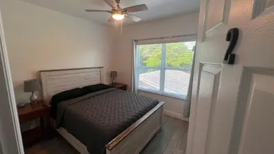 a bedroom with a bed and a large window at Luxe Fort Lauderdale in Fort Lauderdale