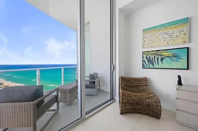 a living room with a view of the ocean at Beautiful Beachfront Penthouse in Hollywood