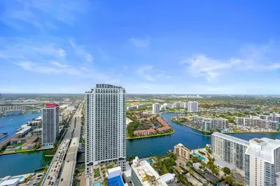 an aerial view of a city with a river and buildings at Beautiful Beachfront Penthouse in Hollywood