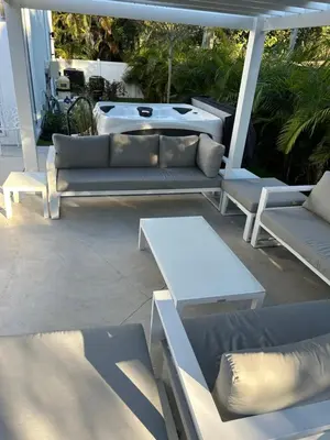 a group of couches and tables on a patio at Men only clothing option guesthouse near Wilton Manors in Fort Lauderdale