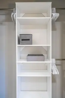 a white book shelf with a box on it at Renovated 2 BD Home w/ Private Parking, Gallery & W/D in Miami