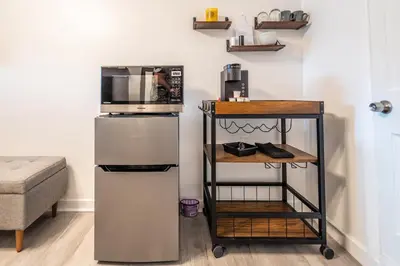 a kitchen with a microwave on top of a refrigerator at Cozy Studio w/gated parking in Miami