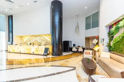 a living room with a large pipe in the middle of it at TRUMP INTERNATIONAL BEACH RESORT 2 BEDROOM APARTMENT 1600 Sf Ocean and Bay View With Terrace in Miami Beach